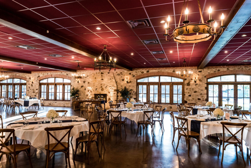 The reception hall at Duchman Winery, with wine-red ceilings and stone walls