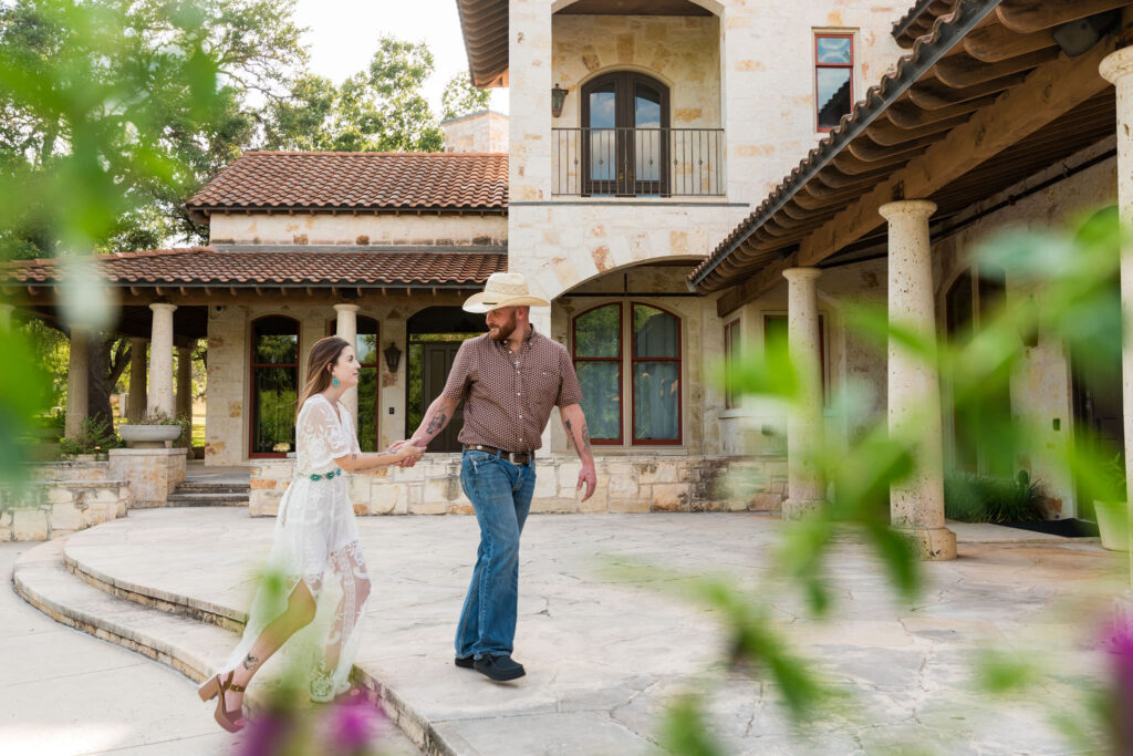 A couple walks the patio at The Garey House in Georgetown, TX