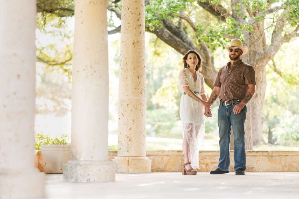 a couple poses at the Garey House in Georgetown, TX for their proposal session