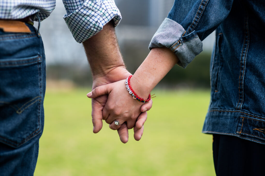 close up of couple holding hands