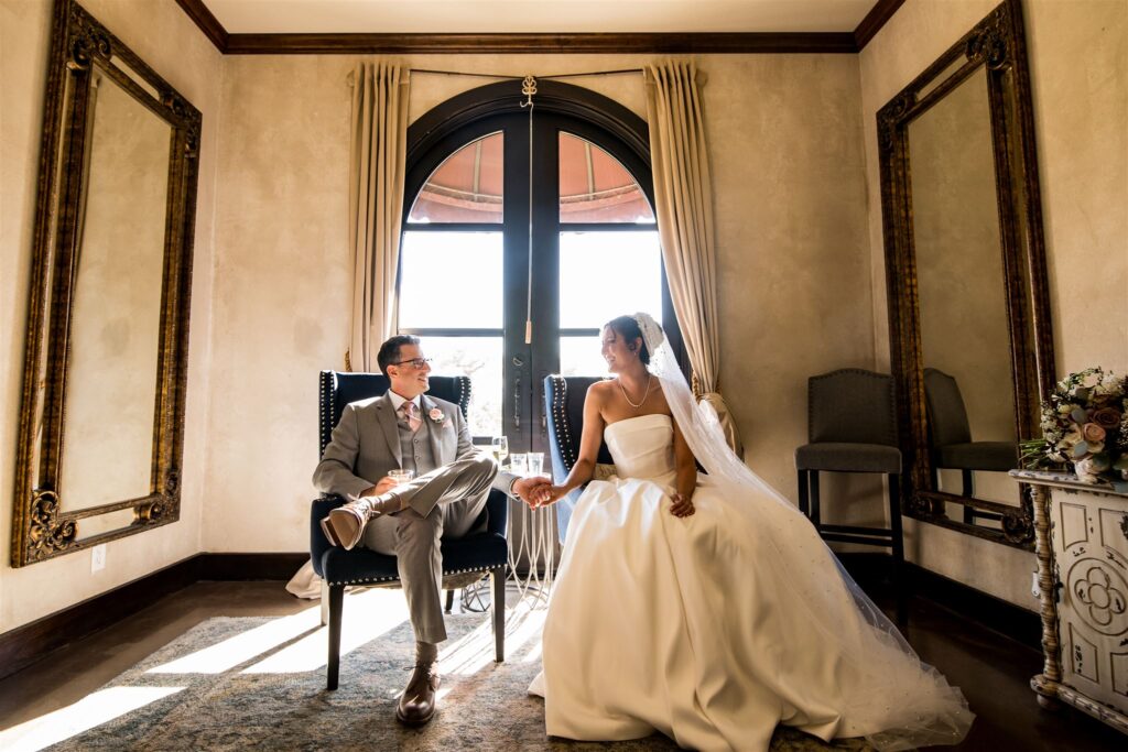 A newly married couple pose inside Ma Maison for their photography portraits