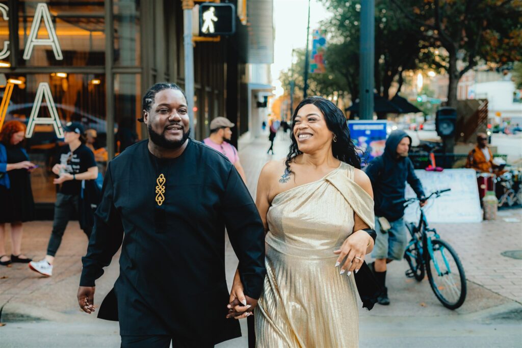 A couple laughs as they walk down South Congress in Austin, Texas
